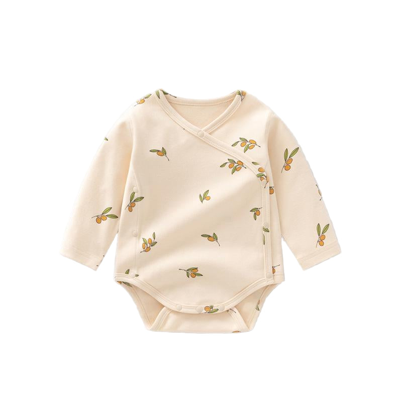 Beige baby bodysuit with fruit pattern on a light gray background